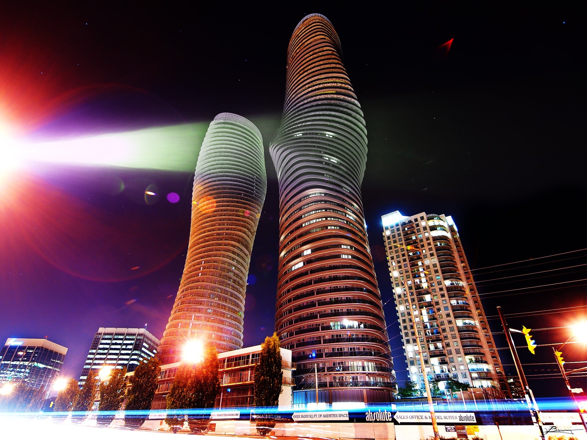 Absolute World towers and Mississauga skyline at night — Mississauga home value guide